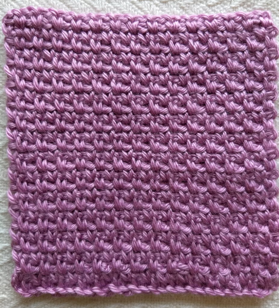 A 6" square sample of moss stitch crochet