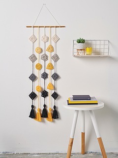 Gray and yellow geometric crocheted wall hanging